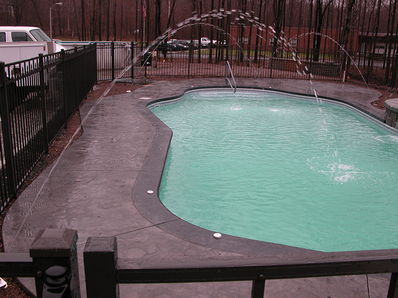 Swimming pool and stamped concrete project example 125